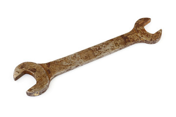 Old rusty spanner isolated on white background