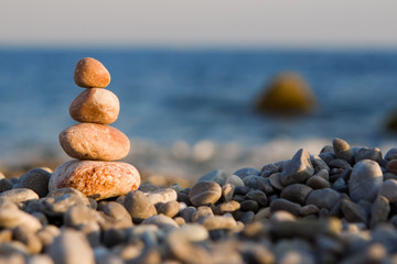 Fototapeta na wymiar balanced stones on the sea