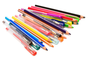 Color pencils and pens on a white background