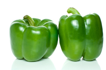 Two green sweet peppers isolated on the white background