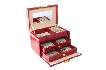 The red casket with jewelry is photographed a close-up