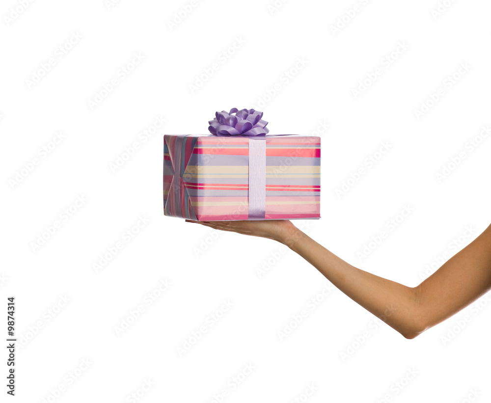 Wall mural female hand holding a box of gifts