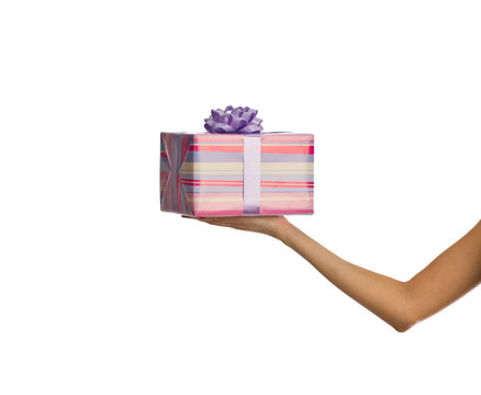 Female hand holding a box of gifts
