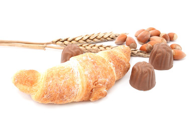 croissant with chocolate and wheat isolated on white