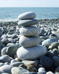 Fototapeta na wymiar stack of a pebble stones on a beach