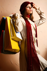 Portrait of young beautiful women with her shopping bags - 9884590