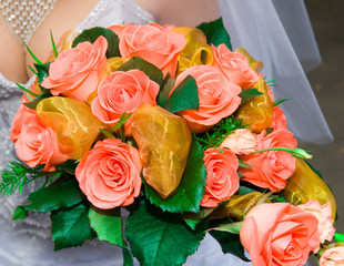 red rose bouquet in girls hand in wedding time