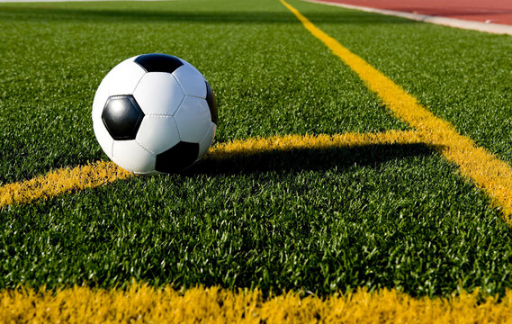 A soccer ball or football on a soccer field