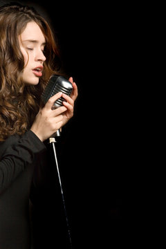 Beautiful sexy young woman singing