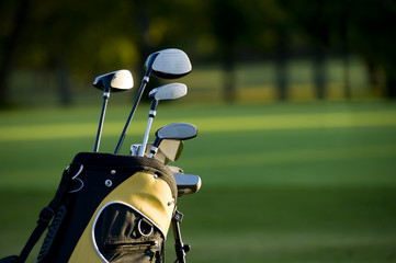 A set up new golf clubs on a beautiful golf course - 9891151