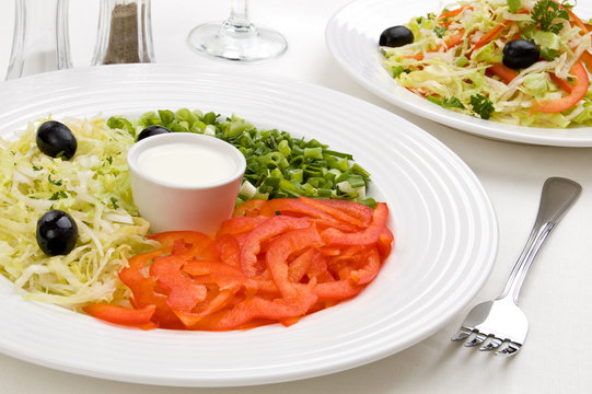 Vegetable salad - pepper, chives, lettuce and olives