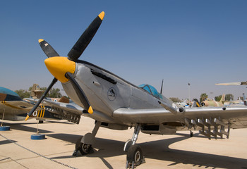 Propellor driven aircraft parked on an airstrip