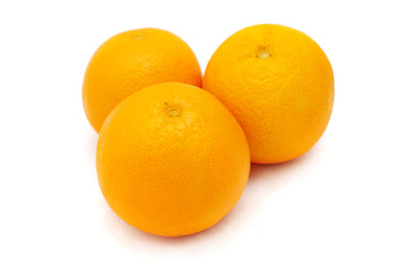 Close up of three oranges isolated on white background.