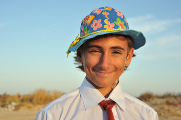 Close up portrait of young boy in shirt and tie