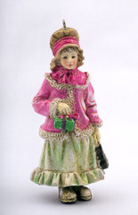 christmas doll, small statuette of the girl holding a gift.