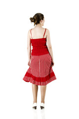 Rear view of a beautiful woman with a red dress