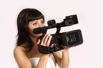 pretty girl holding HDV camcorder isolated on white
