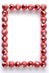 Border Made From Red Baubles Against White Background