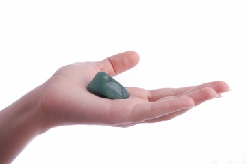 Hand holds aventurine - semiprecious gem
