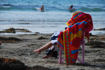 Child Wrapped in Towel at Beach