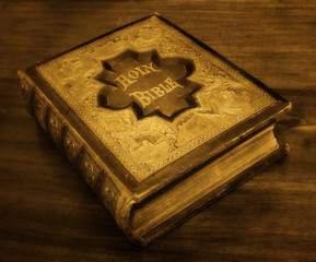 Antique Bible in sepia tones.