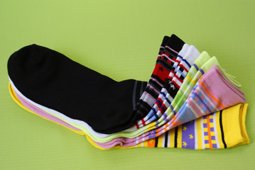 socks with yellow bow on green background
