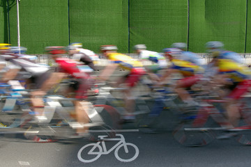 Fototapeta premium Cyclist passing with cycle-path in foreground