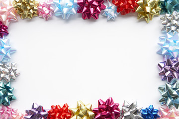 Border Made From Colourful Gift Bows Against White Background