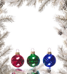 Christmas frame with colorful baubles and silver branches