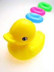 children's toy  duck, yellow color and circles,  close up