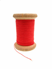 Reel of red thread, closeup, isolated