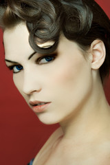 A female pinup model with a fashion hair style.