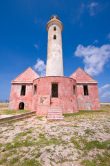 ancient lighthouse ruin on little curacao  blue cloudy sky
