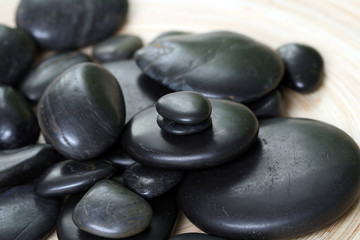 Fototapeta na wymiar black pebbles - beauty treatment