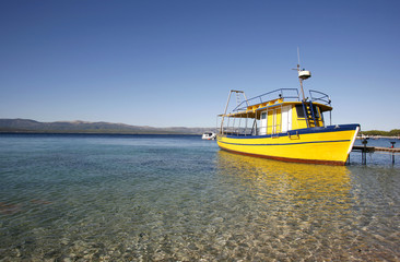 Naklejka na ściany i meble Yellow diving boat on Brac island, Croatia