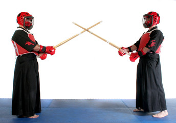 Two martial arts practicing ready to fight with wood swords