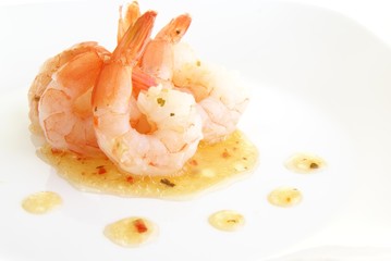 Shrimp with tails in herb oil salad dressing or sauce