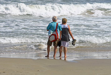 retired couple on the beach