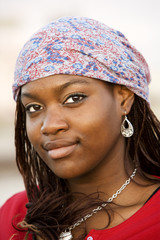 Closeup of a pretty African American woman with a scarf