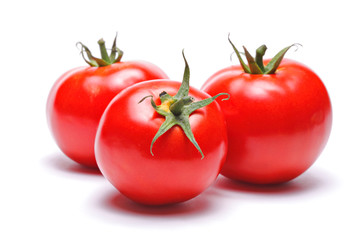 Three tomatoes isolated against white background