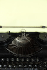 Antique manual typewriter with sheet of paper for your notes