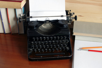 Antique manual typewriter with sheet of paper