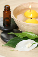 bowl of pure water and candles - beauty treatment