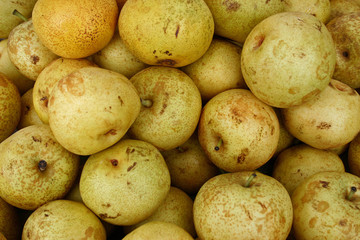 A large group of beautiful yellow pears