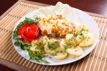 meat with potatoes and vegetable.Italian kitchen