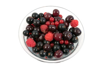 Plateful of berries on a white background