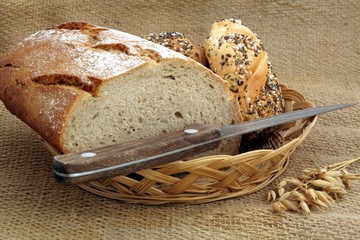 bread and knife on basket