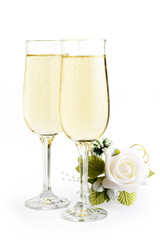 two glasses champagne and bouquet flowers