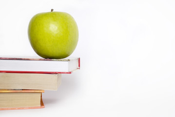 apple and stack of books