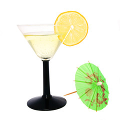 Cocktail in cocktail glass with lemon and umbrella